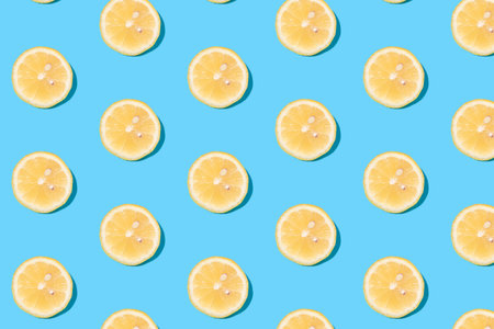 fashion pattern. Summer pattern of yellow lemon slices on light-mint background. Minimal summer...