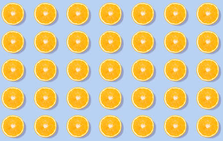 Bright circles of orange on a pale purple background - a creative pattern of trendy colorsの写真素材