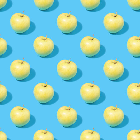 Seamless summer background with green apples - absolutely seamless pattern of green apples on a blue backgroundの写真素材