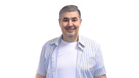 A man is smiling at the camera. Image isolated on a white background.の写真素材