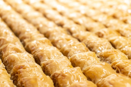 Close-up of Turkish baklava, a sweet pastry soaked in honey. The image is suitable for a restaurant menu.の写真素材