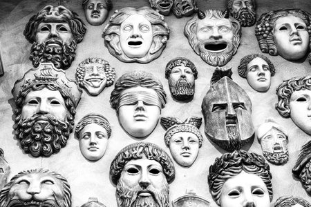 Ancient Greek masks. Traditional theatrical masks. Black and white image. The concept of multifacetedness and variability.の写真素材