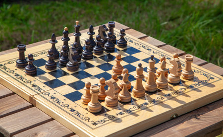 Table with a chessboard and arranged chess pieces