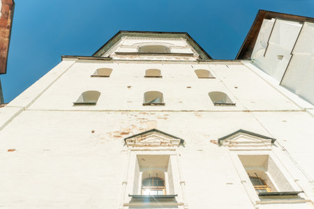 The bell tower of the Kirillo-Belozersky Monastery (Russia). Medieval Orthodox architecture. Clear, sunny summer day. Low angle view.の写真素材