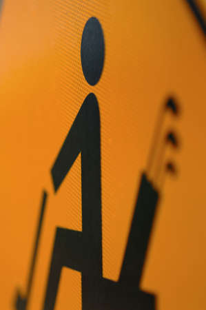 close up of golf cart caution sign.  very shallow depth of field, only golfers head is in focusの写真素材