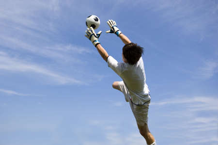Soccer Football Goalie making diving saveの写真素材
