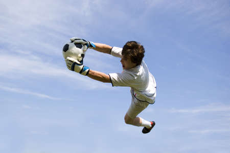 Soccer Football Goalie making diving saveの写真素材