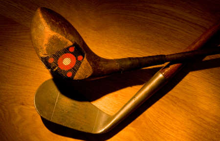 Old, vintage, antique golf clubs painted with light from a flashlightの写真素材