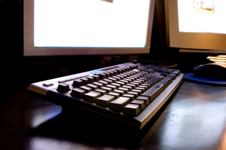 Two monitor computer workstation with wireless keyboard and mouse