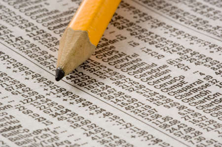 Newspaper open to market pages showing results.  Idea of studying the marketsの写真素材