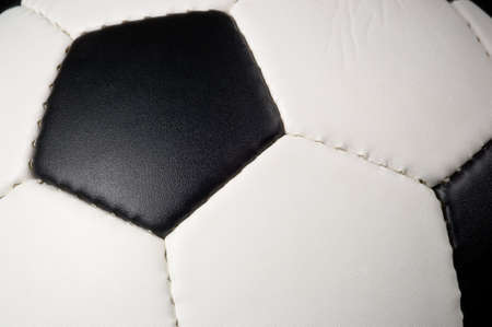 football - soccer ball on black background with reflectionの写真素材