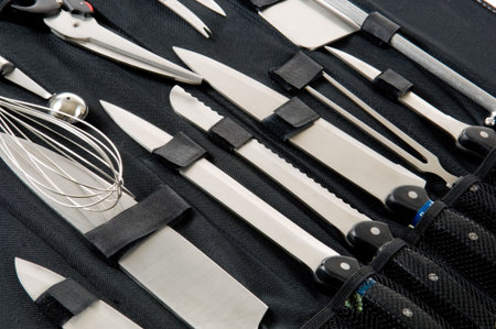 Professional chefs, cooks knife set in black case on white background