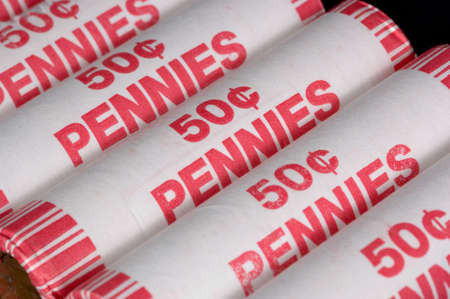 rolls of american pennies on black backgroundの写真素材