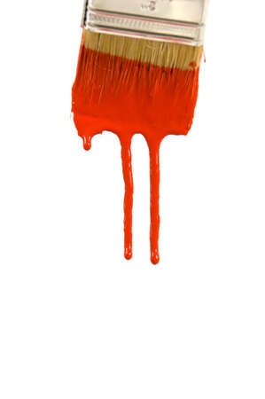 Dripping red paint against a bright white backgroundの写真素材