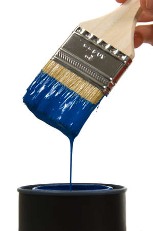 Dripping blue paint against a bright white backgroundの写真素材