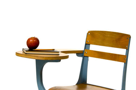 School desk with apple on white backgroundの写真素材