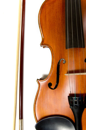 A violin or fiddle and bow on white backgroundの写真素材