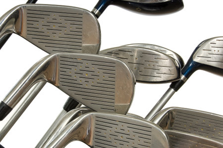 Closeup view of golf clubs in bag on white backgroundの写真素材