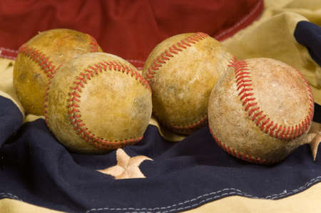 antique baseballs on vintage patriotic buntingの写真素材