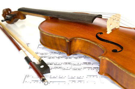 Violin and horsehair bow on sheet music