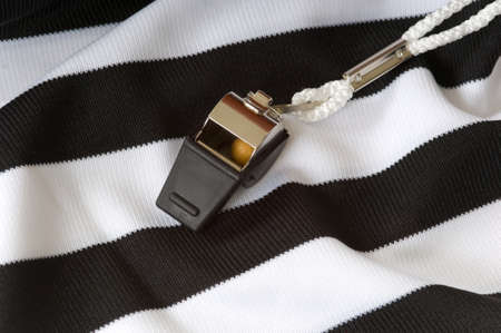 close up of Black and white referee or game official shirt with whistleの写真素材