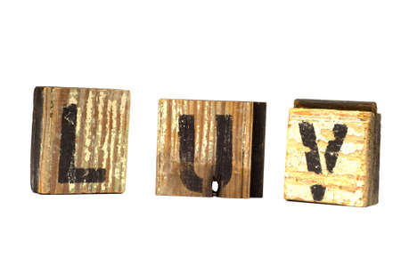 Love decoration with love spelled phonetically on wooden blocks on a white background - possible valentine's day decorationの写真素材