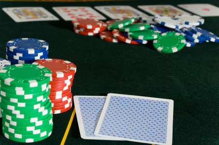 Gambling game with a game of Poker and several denomintions of chipsのeditorial素材