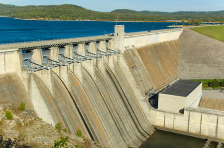 Energy producing power station on a dam at a lakeの写真素材
