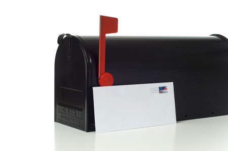 Black mail box on white background with a blank envelope の写真素材