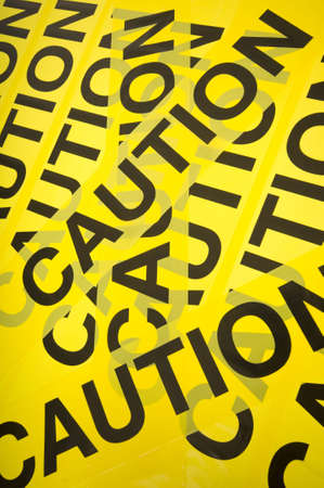 Yellow barrier tape with the word Caution, great backgroundの写真素材