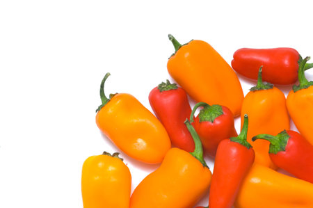 Fresh sweet peppers on white background, with copy space