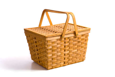 A wicker picnic basket on a white background with copy spaceの写真素材