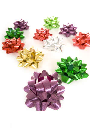 A background consisting of Christmas bows on a white backgroundの写真素材