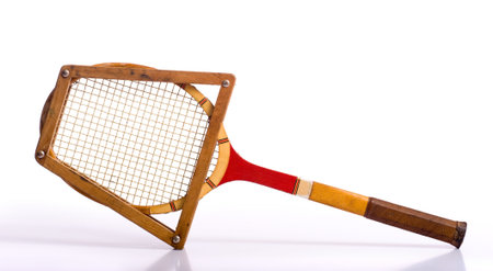 A vintage tennis racket on a white background