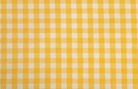 Yellow Gingham or checked tablecloth backgroundの写真素材