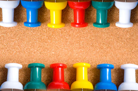 a bulletin board or cork board background with push pins and copy space or add notes etcの写真素材