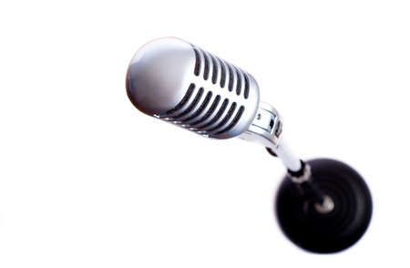 A vintage looking microphone on a white background with copy spaceの写真素材