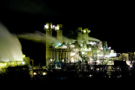 A power or energy producing plant at nightの写真素材
