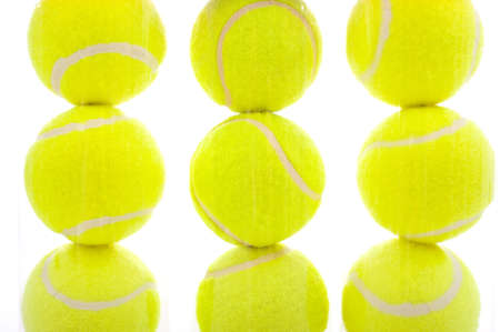 Several tennis balls on a white background with copy spaceの写真素材