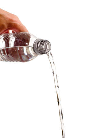 A bottle of water being poured out on a white background with copy spaceの写真素材