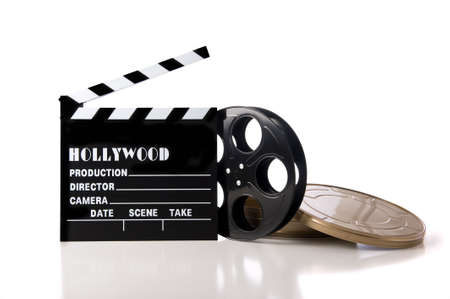 Hollywood movie items including a clapboard and a movie reel and tin on a white backgroundの写真素材