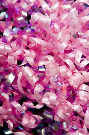 A curly ribbon or bow background.  Birthday present wrappingの写真素材