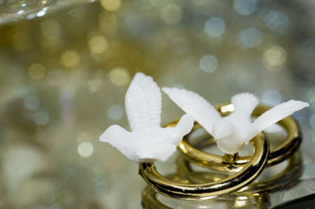 A macro of love bird ring decorations for a 50th wedding anniversary with copy spaceの写真素材