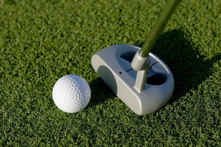 A short put in the game of golf with a ball and a putter