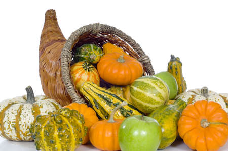 A harvest, autumn or thankgiving conucopia with corn, pumpkins, apples, etcの写真素材