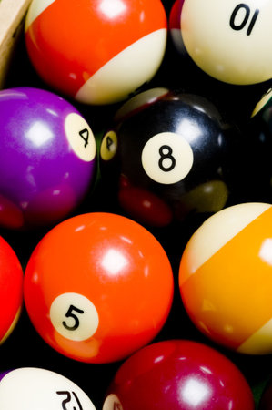 A colorful pool or billiard ball background with the 8-ball in the middle