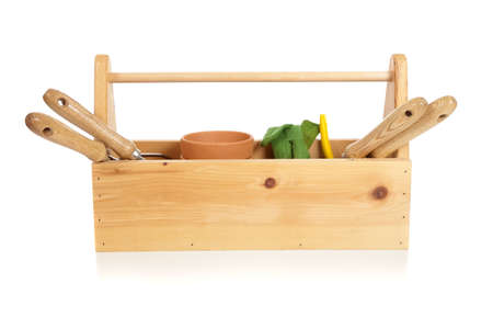 A gardener's tote box on a white background with tools, plants and glovesの写真素材