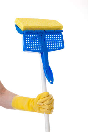 A hand holding a household mop on a white backgroundの写真素材