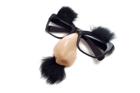 A set of "Groucho Marx" glasses with nose, mustache and eyebrows on a white background.  Funny glasses with noseの写真素材