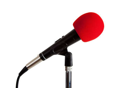 A microphone with red foam windscreen on a white background with copy spaceの写真素材